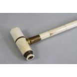 A VICTORIAN SECTIONAL BONE WALKING STICK of plain tapering cylindrical form, the handle unscrewing