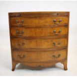 A SMALL REGENCY STYLE MAHOGANY CHEST OF DRAWERS, 20th century, of bowed form, crossbanded with