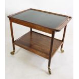 A LUDVIG PONTOPPIDAN ROSEWOOD TEA TROLLEY, c.1950's, of rounded oblong form, the recessed top with