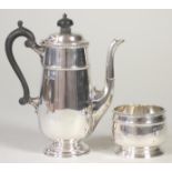 A SILVER HOT MILK JUG AND SUGAR BASIN, makers Mappin & Webb, Sheffield 1925, of rounded tapering