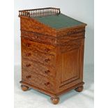 A SATINWOOD GILLOW STYLE DAVENPORT, c.1900, the sliding top with three quarter spindle gallery