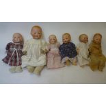 Four Armand Marseille bisque head baby dolls with blue glass sleeping eyes, open mouth, moulded