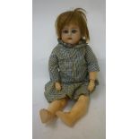 A Kammer & Reinhardt bisque head doll with blue glass sleeping eyes, open mouth and teeth, blonde