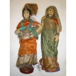 A pair of Indian female costume dolls, c.1924, with stuffed fabric heads and bodies, painted faces