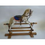 A small rocking horse probably by Collinson on safety stand, mid 20th century,