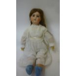A J. Verlingue "Petite Francaise" bisque head doll with fixed blue glass eyes, open mouth and teeth,
