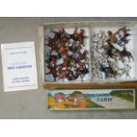 A large quantity of Britains metal hunt figures and hounds, and two foxes, approximately sixty eight