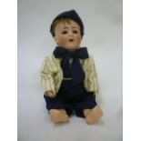 An Alt Beck & Gottschalck bisque head body character doll with blue glass sleeping eyes, brown