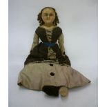 A wax shoulder head doll with fixed brown glass eyes, brown mohair wig, stuffed fabric body, kid