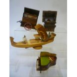 Four novelty musical cigarette boxes comprising a Gondola in satin birch with marquetry inlaid lid