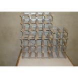 Two 12-section wood and metal wine racks and another 8-section rack (3)