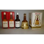 Three bottles Haigh Gold Label Blended Scotch (two boxed), and one pottery decanter Bell's