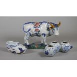 A DUTCH DELFT MODEL OF A COW, mid 19th century, modelled standing with blue, green and burnt