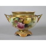 A ROYAL WORCESTER CHINA SMALL ROSE BOWL, 1912, of squat globular form with pierced rim and two