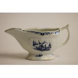 A FIRST PERIOD WORCESTER PORCELAIN SMALL SAUCEBOAT, c.1770, painted in underglaze blue with the "