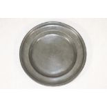 A DUTCH PEWTER DISH, 18th century, with single reeded rim and gentle booge, 14 1/2" wide