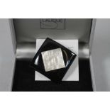 "MASQUE DE FEMME" - a Lalique glass brooch, the square clear moulded panel inset into a black