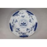 A DUTCH DELFT CHARGER, late 18th century, of plain dished circular form, centrally painted in blue