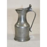 A FRENCH PEWTER WINE MEASURE, 18th century, of typical form with scrolled handle and double acorn