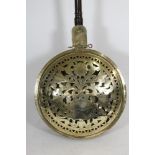 AN ANGLO-DUTCH BRASS WARMING PAN, early 18th century, the domed lid pierced with a vase of