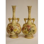 A PAIR OF ROYAL WORCESTER CHINA BOTTLE VASES, 1892, with dolphin handles, painted in polychrome