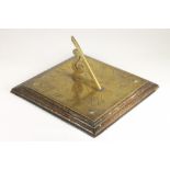 A GEORGIAN STYLE BRASS SUNDIAL, late 19th century, the square plate chased with compass points and