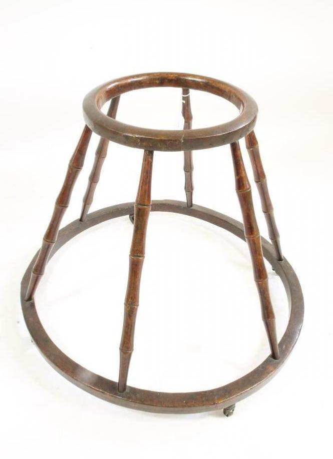 A GEORGIAN BEECH BABY WALKER, early 19th century, the two hoops linked by faux bamboo supports, on