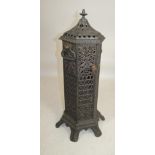 A VICTORIAN CAST IRON "CATHEDRAL" STOVE, of hexagonal form with lift off swept cover and dolphin