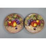 A PAIR OF ROYAL WORCESTER CHINA TEA PLATES, 1954/5, of plain circular form, painted in polychrome
