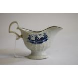 A PENNINGTON'S LIVERPOOL PORCELAIN SAUCE BOAT, c.1780, of acanthus moulded oval form with biting