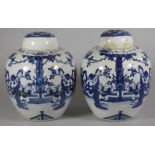 A PAIR OF CHINESE PORCELAIN JARS AND COVERS of ovoid form, painted in underglaze blue with two