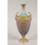 A ROYAL WORCESTER CHINA VASE, 1896, of flared rounded cylindrical form with fluted neck and mask lug