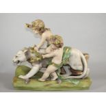 AN AMPHORA BISQUE PORCELAIN FIGURE GROUP, early 20th century, modelled as a Bacchanalian putti