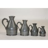 A SET OF FOUR IRISH PEWTER MEASURES, 19th century, of haystack form, three stamped Austin Cork, 4" -