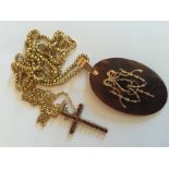 Nine carat gold tortoishell pique pendant and chain together with gem set crucifix and 9 carat