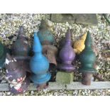 Eleven metal finials of varying size including pairs.