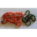 Jade beads together with a coral necklace.