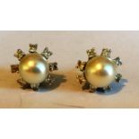 White gold 18 carat pearl and diamond earrings.