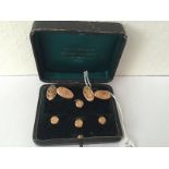 Boxed 9 carat gold cufflinks and shirt studs.