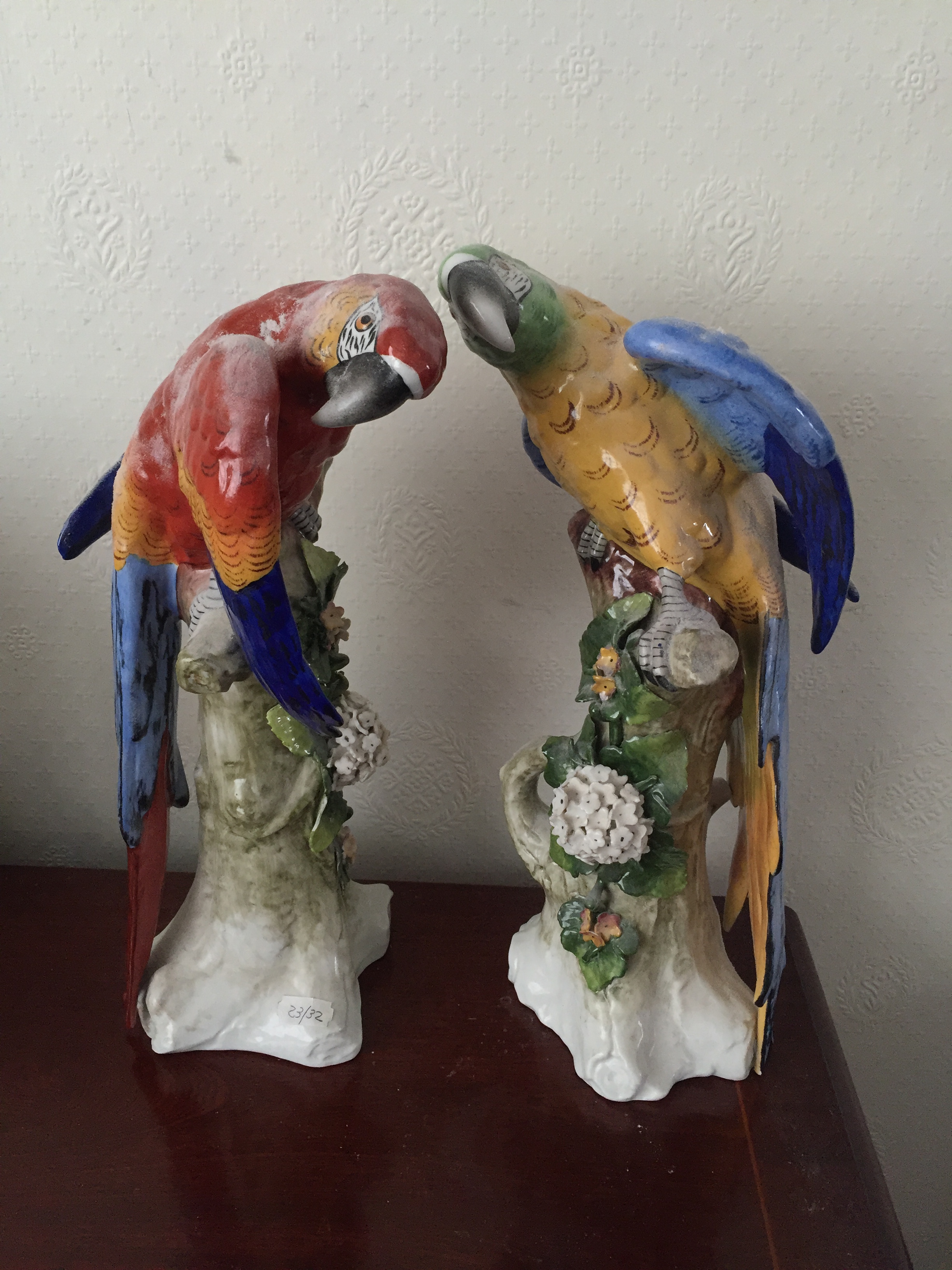 Two Sitzendorf parrots.