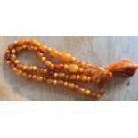 Butterscotch amber bead necklace 74cms long plus drop 5cms, 51.8gms.