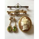 Two nine carat gold bar brooches mounted with seed pearls and topaz, 9 carat gold earrings and a