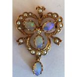 Nine carat gold, opal and seed pearl pendant/brooch.