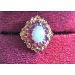 A 9ct gold opal and garnet dress ring size L