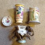 An assortment of pottery including a Clarice Cliffe jug and elephant vase.