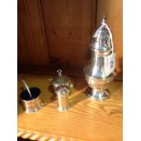 A selection of silver items inc. sugar sifter, cruet set and specimen vase