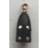 A Victorian novelty watch fob modelled as an Armstrong- Whitworth studded artillary shel lin rose