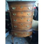 Walnut bowfront chest on stand.