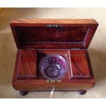 Superb quality Regency flame mahogany tea caddy of sarcophagus form