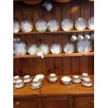 Extensive Noritake tea service, 12 cups, saucers, plates, 2 milk jugs, 2 cake plates, 2 bowls Basket